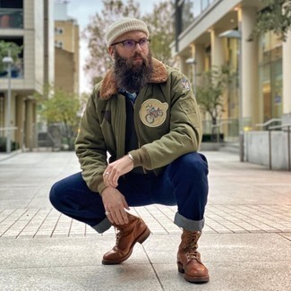 Men's White Beanie, Brown Leather Casual Boots, Navy Jeans, Olive Print Bomber Jacket