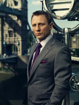 Daniel Craig wearing Charcoal Vertical Striped Blazer, White Dress Shirt, Dark Purple Silk Tie, Dark Purple Silk Pocket Square