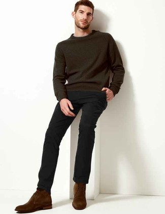Try teaming a charcoal crew-neck sweater with black chinos to create a casually dapper outfit. Complete this look with dark brown suede desert boots and ta-da: your outfit is complete.