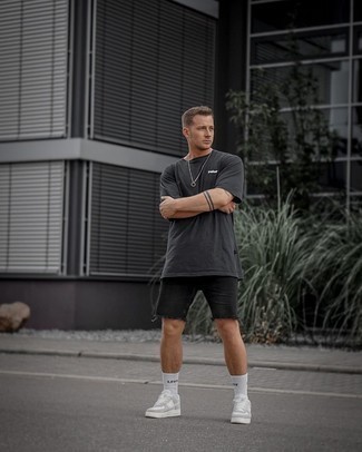 Charcoal Print Crew-neck T-shirt Outfits For Men: A charcoal print crew-neck t-shirt and black denim shorts worn together are a match made in heaven. On the shoe front, this ensemble is completed really well with white leather low top sneakers.