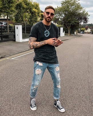 Grey Print Crew-neck T-shirt Outfits For Men: If you're looking for a laid-back yet seriously stylish outfit, go for a grey print crew-neck t-shirt and light blue ripped jeans. On the shoe front, this look is rounded off well with black and white canvas high top sneakers.
