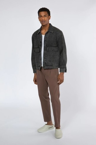 Charcoal Denim Jacket Outfits For Men: Beyond dapper, this casual pairing of a charcoal denim jacket and brown chinos will provide you with variety. If you feel like dialing it up a bit now, complete your look with a pair of white rubber loafers.