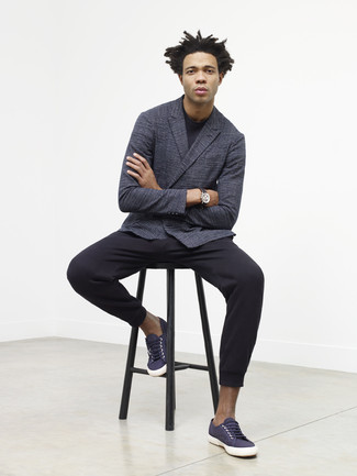 Charlie Casely Hayford wearing Charcoal Double Breasted Blazer, Black Crew-neck Sweater, Black Sweatpants, Navy Canvas Low Top Sneakers