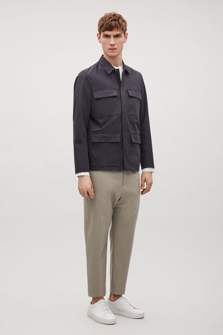 Grey Field Jacket Outfits: A grey field jacket and beige chinos married together are a match made in heaven. Feeling transgressive? Jazz things up by finishing off with white leather low top sneakers.