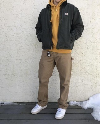 Mustard Hoodie Outfits For Men: Try pairing a mustard hoodie with khaki chinos to achieve a day-to-day ensemble that's full of style and character. White leather low top sneakers are a great option to complete your outfit.