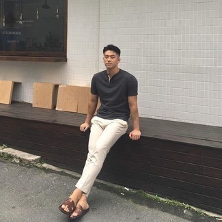 Charcoal Henley Shirt Outfits For Men: A charcoal henley shirt and white chinos are a combo that every smart gentleman should have in his off-duty arsenal. Give an easy-going vibe to your ensemble by wearing a pair of dark brown leather sandals.
