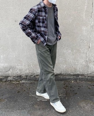 Charcoal Plaid Long Sleeve Shirt Outfits For Men: This combination of a charcoal plaid long sleeve shirt and olive chinos is on the off-duty side yet it's also sharp and seriously sharp. We're loving how a pair of white leather low top sneakers makes this ensemble complete.