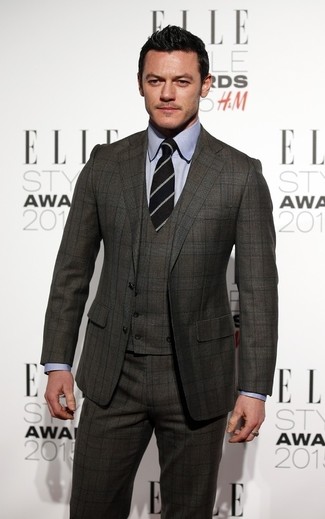 Consider teaming a charcoal plaid three piece suit with a grey dress shirt if you're going for a clean-cut, classic look.