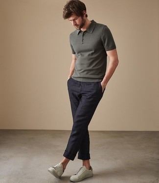 Grey Polo Outfits For Men: This relaxed combo of a grey polo and navy chinos is a real lifesaver when you need to look dapper but have no extra time. Introduce a pair of mint suede low top sneakers to the mix and the whole outfit will come together.