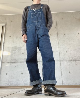 Navy Denim Overalls Outfits For Men: For a casually dapper ensemble, choose a charcoal print sweatshirt and navy denim overalls — these two items fit really well together. Bump up this whole outfit by rounding off with black leather chelsea boots.