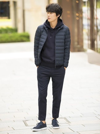 Grey Puffer Jacket Outfits For Men: Consider wearing a grey puffer jacket and navy vertical striped chinos to assemble an effortlessly neat and modern-looking outfit. Why not complement your ensemble with navy canvas low top sneakers for a dash of stylish effortlessness?