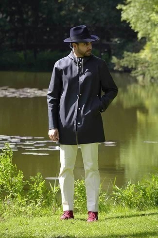 Navy Wool Hat Outfits For Men: If you're all about relaxed styling when it comes to your personal style, you'll love this relaxed casual combo of a charcoal raincoat and a navy wool hat. Inject your outfit with an air of elegance by finishing with a pair of burgundy canvas high top sneakers.