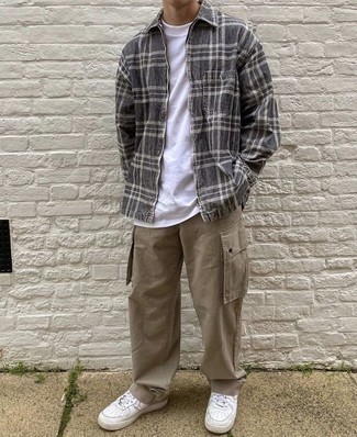 Khaki Cargo Pants Outfits: Marry a charcoal plaid shirt jacket with khaki cargo pants for a casual kind of sophistication. A pair of white leather low top sneakers can integrate nicely within a multitude of combos.