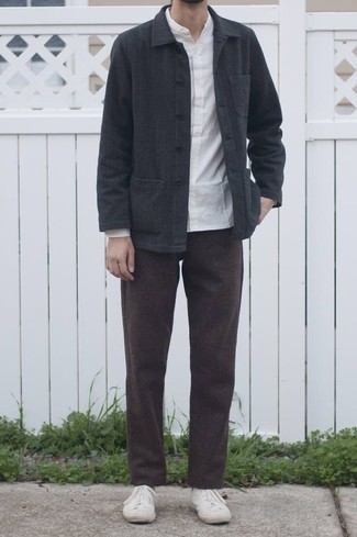 Charcoal Shirt Jacket Outfits For Men: This combo of a charcoal shirt jacket and dark brown chinos looks amazing, but it's also super easy to replicate. For something more on the casually cool end to finish off this outfit, complement this outfit with white canvas high top sneakers.