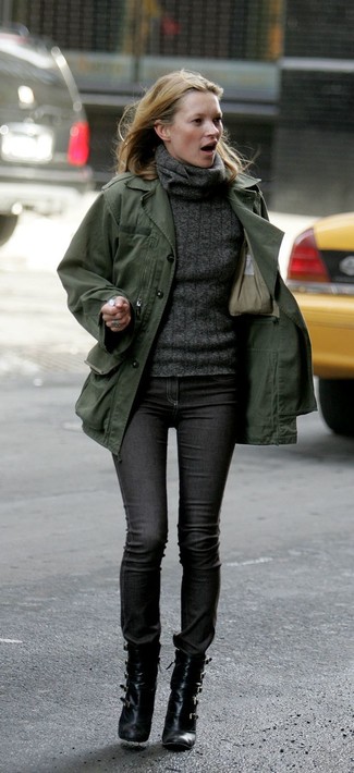 Kate Moss wearing Black Leather Ankle Boots, Charcoal Skinny Jeans, Charcoal Knit Turtleneck, Olive Military Jacket