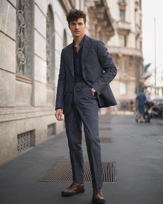 Navy Dress Shirt Outfits For Men: A navy dress shirt and a charcoal suit are absolute essentials if you're crafting a smart wardrobe that holds to the highest menswear standards. Got bored with this getup? Let dark brown leather casual boots mix things up.