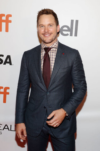 Chris Pratt wearing Charcoal Vertical Striped Suit, White and Brown Plaid Dress Shirt, Burgundy Tie, Gold Watch