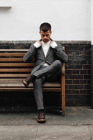 Charcoal Wool Suit Outfits: A charcoal wool suit looks especially classy when worn with a white crew-neck sweater in a modern man's look. Complete your ensemble with dark brown leather derby shoes et voila, this outfit is complete.