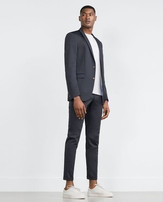Grey Suit with Low Top Sneakers Outfits: For an outfit that's absolutely camera-worthy, wear a grey suit with a white crew-neck t-shirt. Finishing with a pair of low top sneakers is a fail-safe way to introduce a more relaxed feel to your outfit.