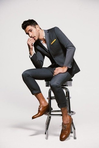 Tobacco Leather Brogues Outfits: Team a charcoal suit with a white dress shirt to look neat and smart. And if you need to instantly play down this ensemble with one single piece, complete this outfit with a pair of tobacco leather brogues.