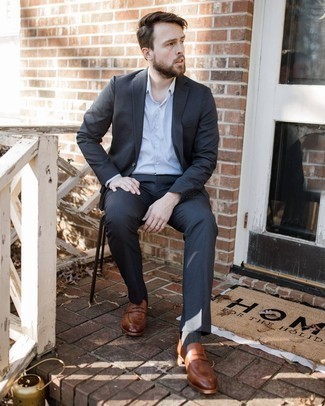 Brown Leather Loafers Dressy Outfits For Men: This combination of a charcoal suit and a white dress shirt is a real life saver when you need to look classy and really sharp. A pair of brown leather loafers easily kicks up the appeal of this getup.