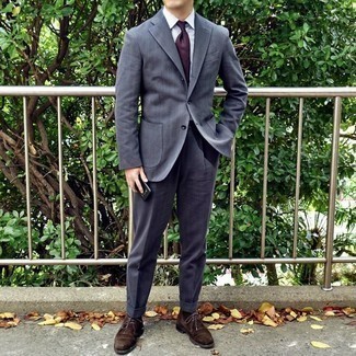 Burgundy Tie Outfits For Men: Consider teaming a charcoal suit with a burgundy tie to look smooth and sharp. Why not add a pair of dark brown suede desert boots to the equation for a little edge?