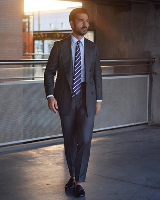 Navy and White Horizontal Striped Tie Outfits For Men: You're looking at the hard proof that a charcoal suit and a navy and white horizontal striped tie are awesome when worn together in a polished getup for today's man. Infuse a dose of stylish effortlessness into this look with navy leather tassel loafers.
