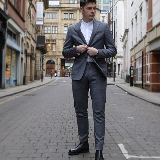 Charcoal Suit with Black Leather Chelsea Boots Outfits: Show off your classy self in a charcoal suit and a white long sleeve shirt. A pair of black leather chelsea boots is a never-failing footwear option here that's full of personality.
