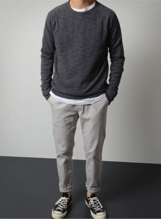 Charcoal Sweatshirt Outfits For Men: To pull together a casual getup with a modernized spin, wear a charcoal sweatshirt and grey chinos. A pair of black and white canvas low top sneakers will pull this full ensemble together.