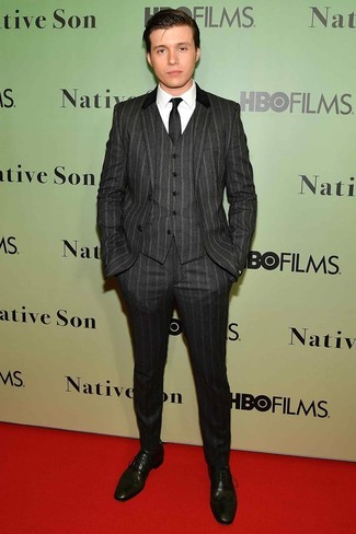 Nick Robinson wearing Charcoal Vertical Striped Three Piece Suit, White Dress Shirt, Olive Leather Oxford Shoes, Black Tie