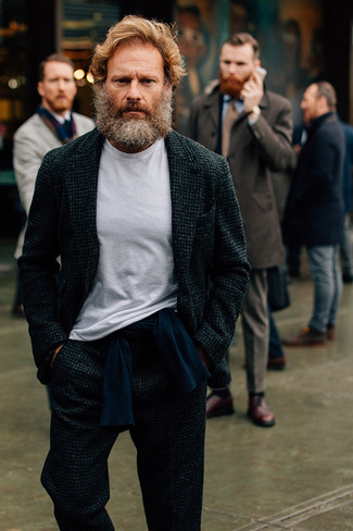 Make a charcoal wool suit and a navy crew-neck sweater your outfit choice if you're going for a proper, stylish outfit.