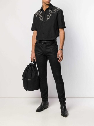 Men's Black Canvas Backpack, Black Leather Chelsea Boots, Black Jeans, Black Embroidered Short Sleeve Shirt