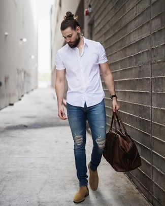 Men's Brown Leather Duffle Bag, Tan Suede Chelsea Boots, Blue Ripped Skinny Jeans, White Short Sleeve Shirt