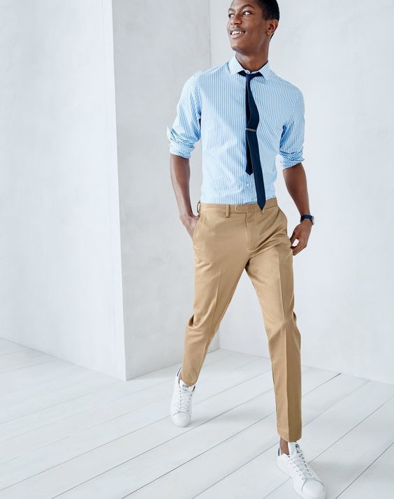 Men's khaki pants worn with a pale blue linen shirt and canvas sneakers  outfit | Shirt outfit men, Blue shirt men, Khaki pants outfit men