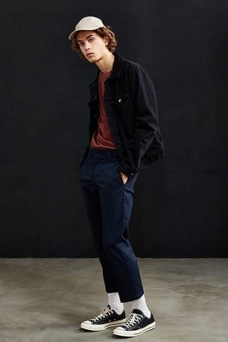 Men's Black and White Canvas Low Top Sneakers, Navy Chinos, Red Crew-neck T-shirt, Black Denim Jacket