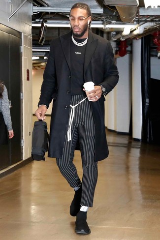 Jae Crowder wearing Black Athletic Shoes, Black and White Vertical Striped Chinos, Black and White Print Crew-neck T-shirt, Black Overcoat
