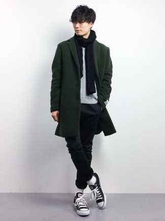 Men's Black and White Canvas Low Top Sneakers, Black Chinos, Grey Crew-neck T-shirt, Dark Green Overcoat