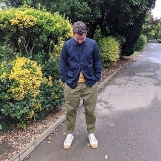 Men's White Canvas Low Top Sneakers, Olive Chinos, Mustard Crew-neck T-shirt, Navy Shirt Jacket