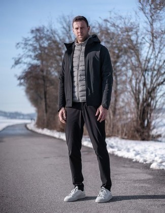 Men's White Canvas Low Top Sneakers, Black Chinos, Grey Quilted Gilet, Black Windbreaker