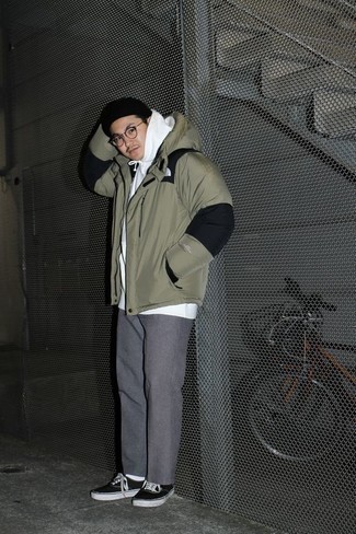 Men's Black and White Canvas Low Top Sneakers, Grey Chinos, White Hoodie, Olive Puffer Jacket