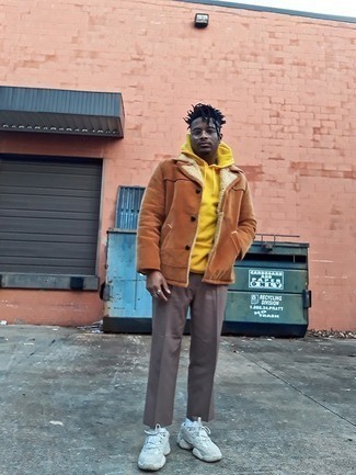 Men's Light Blue Athletic Shoes, Brown Chinos, Mustard Hoodie, Tobacco Shearling Jacket