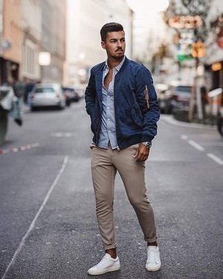 Men's White Canvas Low Top Sneakers, Khaki Chinos, White and Blue Vertical Striped Long Sleeve Shirt, Navy Bomber Jacket