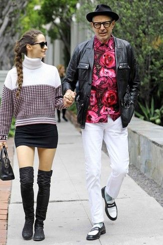 Jeff Goldblum wearing Black and White Leather Loafers, White Chinos, Hot Pink Floral Long Sleeve Shirt, Black Leather Field Jacket