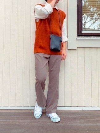 Men's White Canvas Low Top Sneakers, Brown Chinos, White Long Sleeve Shirt, Orange Sweater Vest