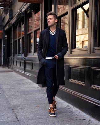 Men's Black Leather Low Top Sneakers, Navy Chinos, Navy and White V-neck Sweater, Black Overcoat