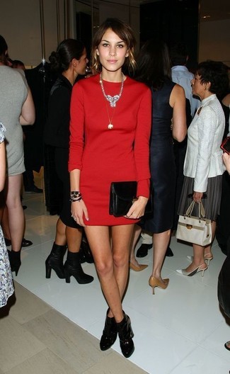 Alexa Chung wearing Silver Necklace, Black Leather Clutch, Black Leather Ankle Boots, Red Sheath Dress