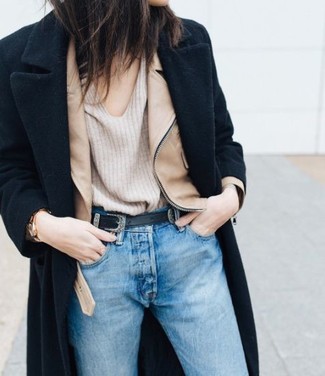 Beige V-neck Sweater Outfits For Women: A beige v-neck sweater and light blue jeans make for the perfect base for an endless number of getups.