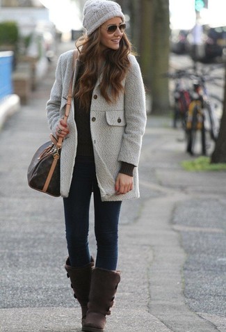 Grey Coat Outfits For Women: A grey coat and navy skinny jeans are veritable must-haves if you're picking out a casual wardrobe that matches up to the highest sartorial standards. A trendy pair of dark brown uggs is an effective way to infuse a touch of casualness into your getup.