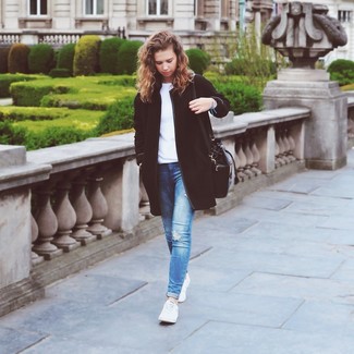 Light Blue Skinny Jeans Outfits: Extremely stylish, this combination of a black coat and light blue skinny jeans provides with wonderful styling possibilities. A pair of white low top sneakers immediately ramps up the wow factor of this outfit.