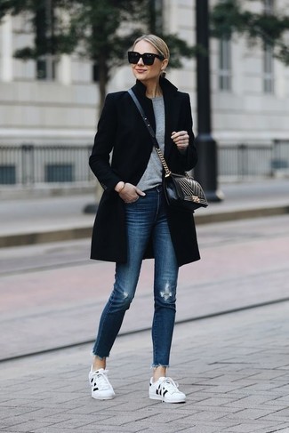 Black Quilted Leather Crossbody Bag Outfits: A black coat looks especially good when paired with a black quilted leather crossbody bag in a casual ensemble. White and black low top sneakers are a great option to round off your outfit.